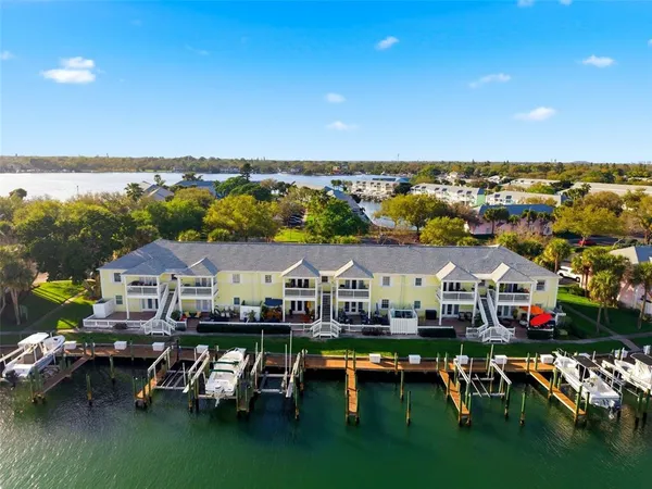 a view of a livingroom with furniture and a book shelf