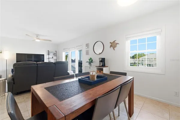 a view of a kitchen with a table and chairs