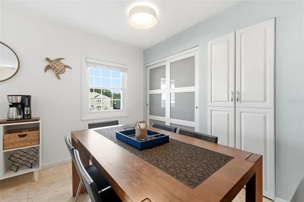 a living room with dining table