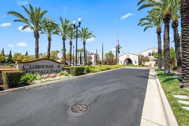 a swimming pool with outdoor seating and yard