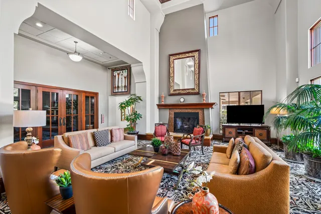 a room with pool table and windows