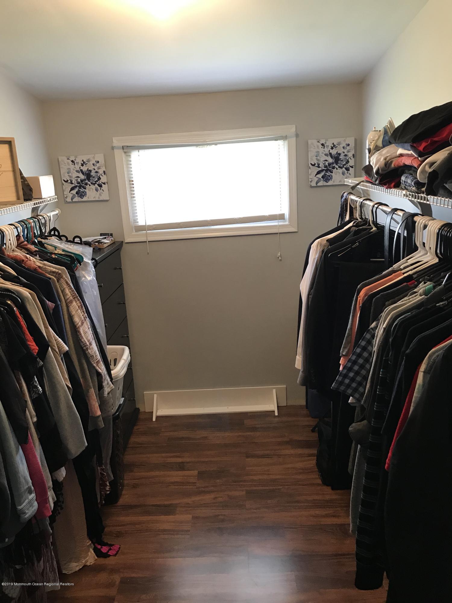 14 Chain Boulevard Bayville, NJ 08721 - Photo 7 of 17 a view of walk in closet with clothes and shoes