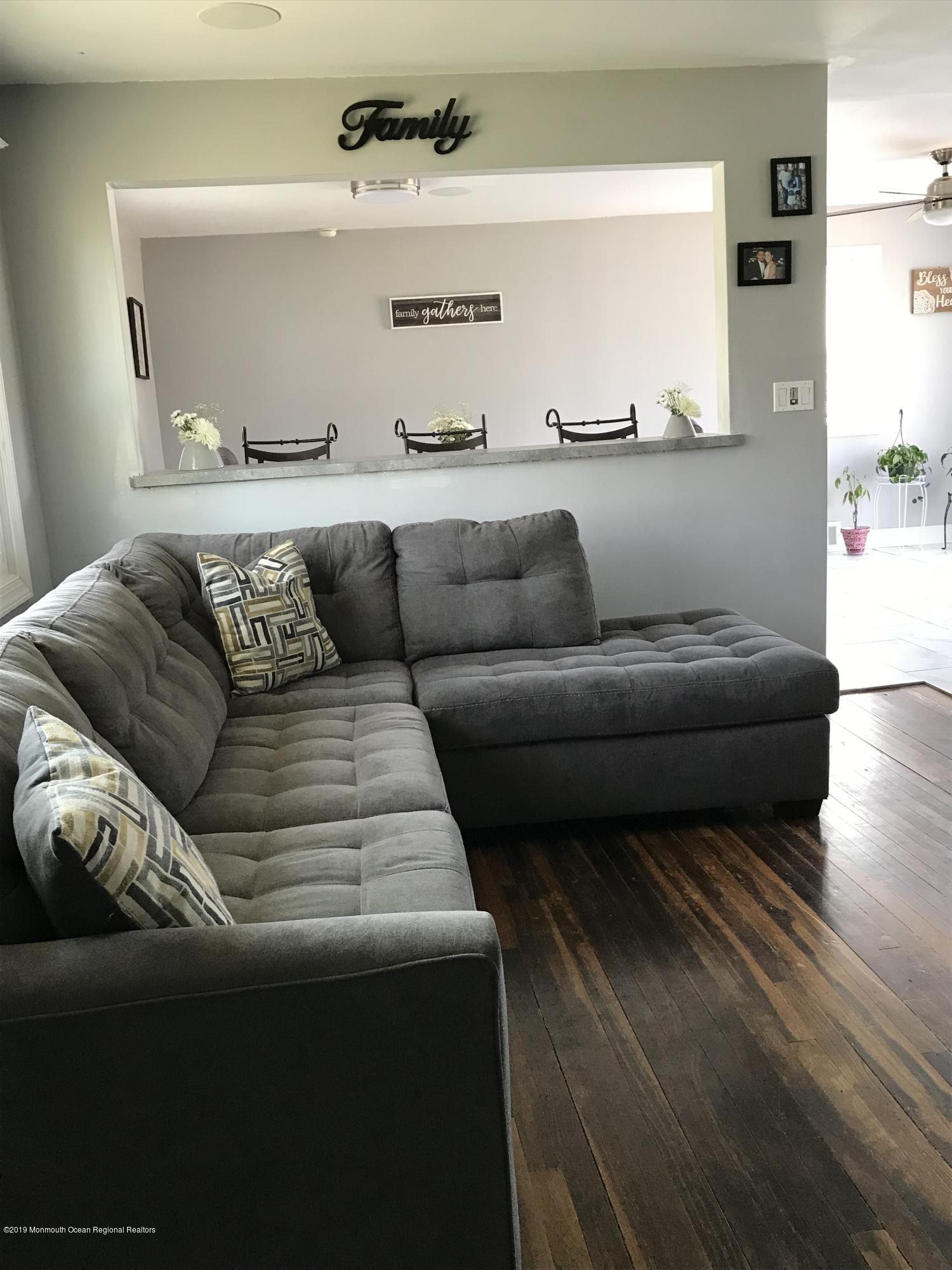 14 Chain Boulevard Bayville, NJ 08721 - Photo 9 of 17 a living room with furniture and a couch