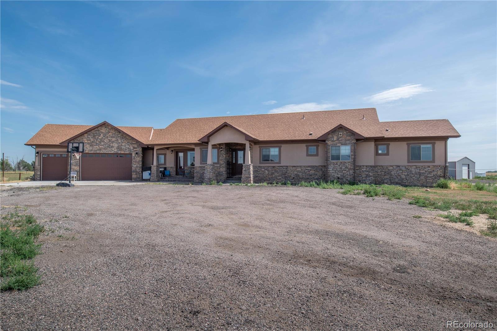 9368-41 41st Fort Fort Lupton, CO 80621 - Photo 1 of 44 a front view of a house with a yard and garage