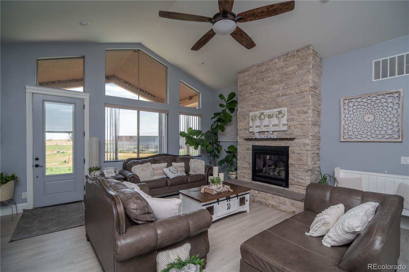 9368-41 41st Fort Fort Lupton, CO 80621 - Photo 5 of 44 a living room with furniture and a fireplace
