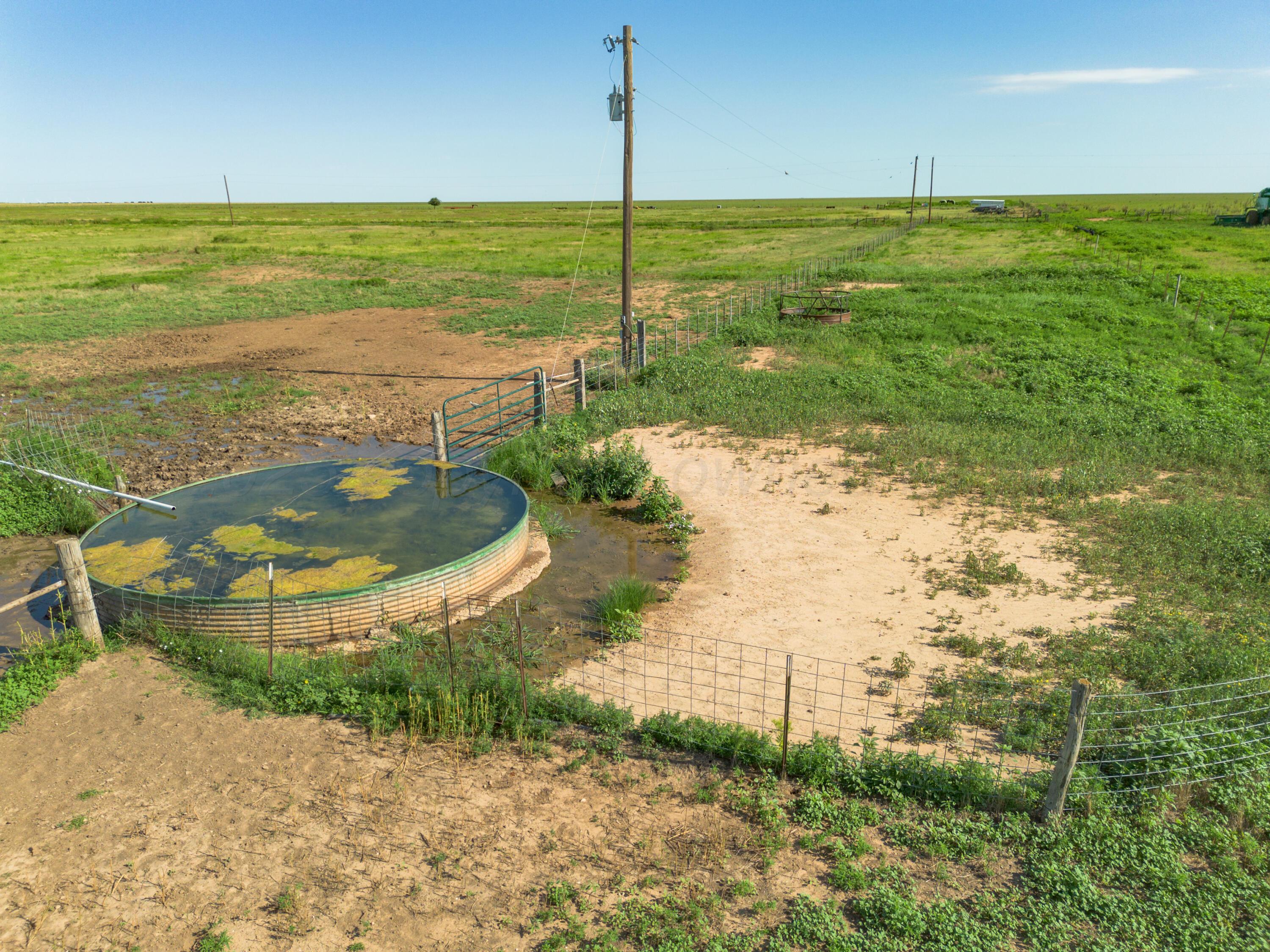 22 Boomer Place Claude, TX 79019 - Photo 4 of 28 a view of a lake with a big yard