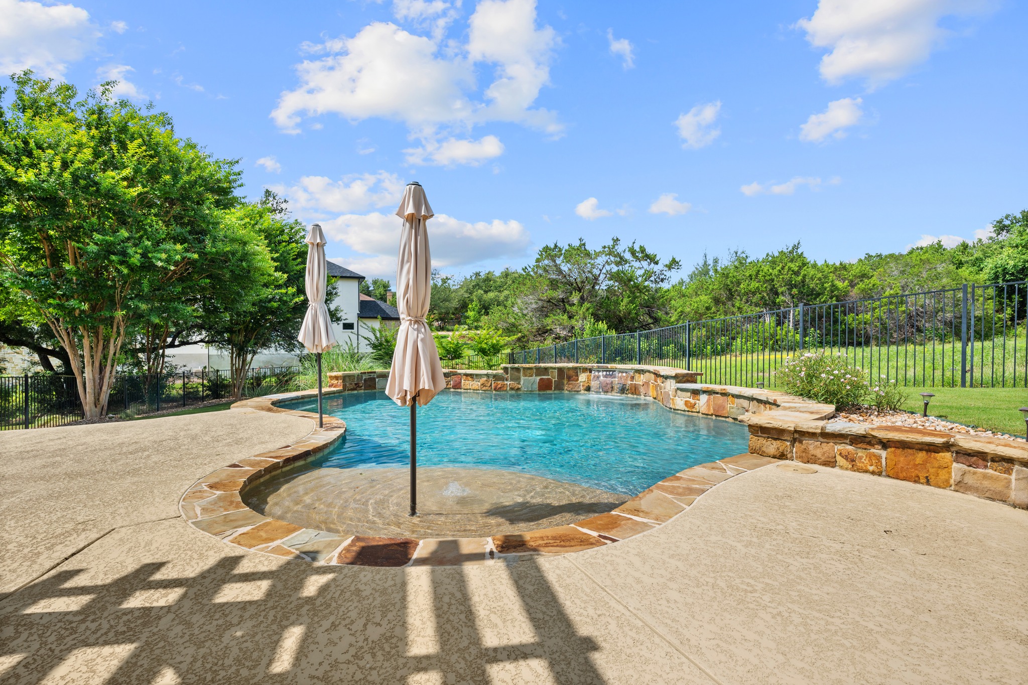 1301 Lions Lair Leander, TX 78641 - Photo 35 of 40 Sparkling pool with relaxing waterfall feature