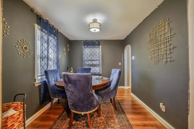 a view of a dining room with furniture and wooden floor