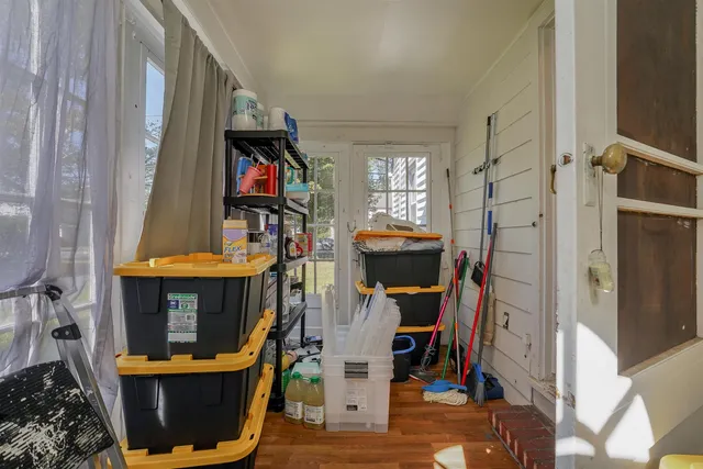 a view of an entryway with wooden floor