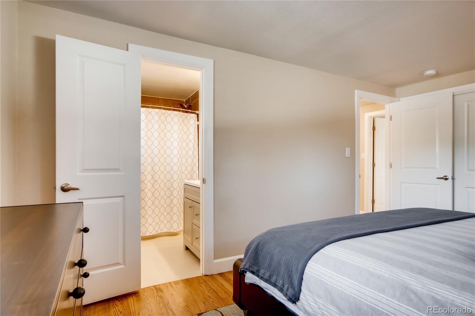 5655 Estes Street Arvada, CO 80002 - Photo 19 of 40 a bedroom with a bed and a window