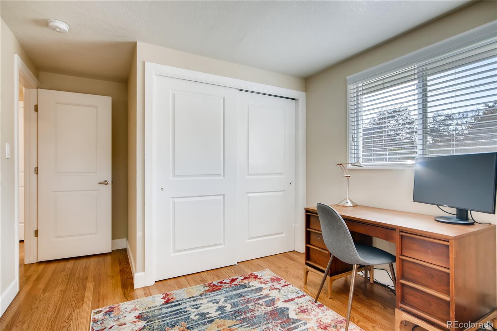 5655 Estes Street Arvada, CO 80002 - Photo 22 of 40 a workspace with furniture and a window