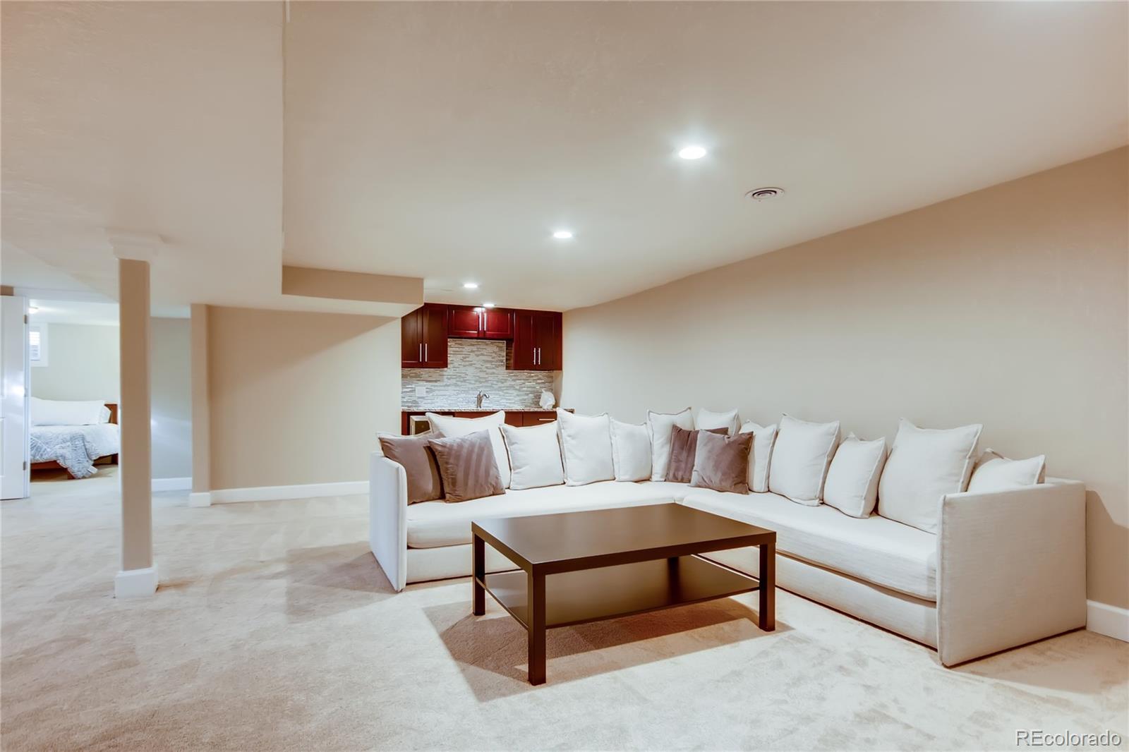 5655 Estes Street Arvada, CO 80002 - Photo 26 of 40 a living room with furniture and a couch