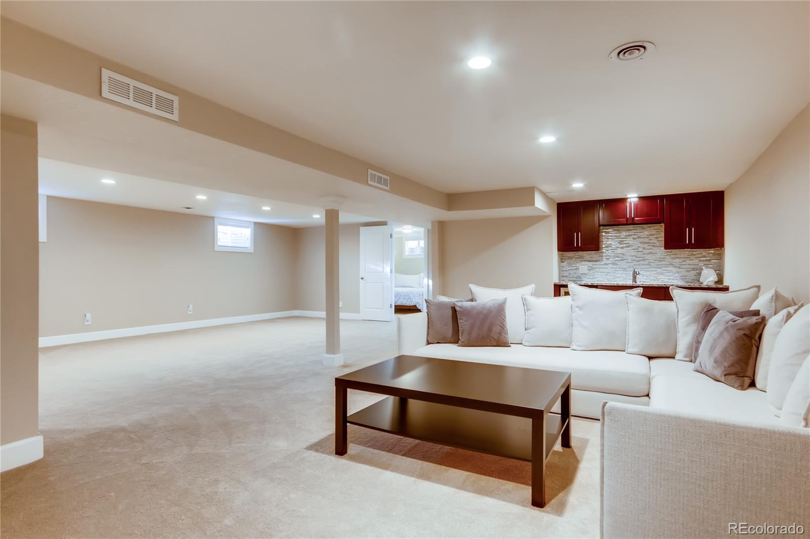 5655 Estes Street Arvada, CO 80002 - Photo 27 of 40 a living room with furniture and a couch