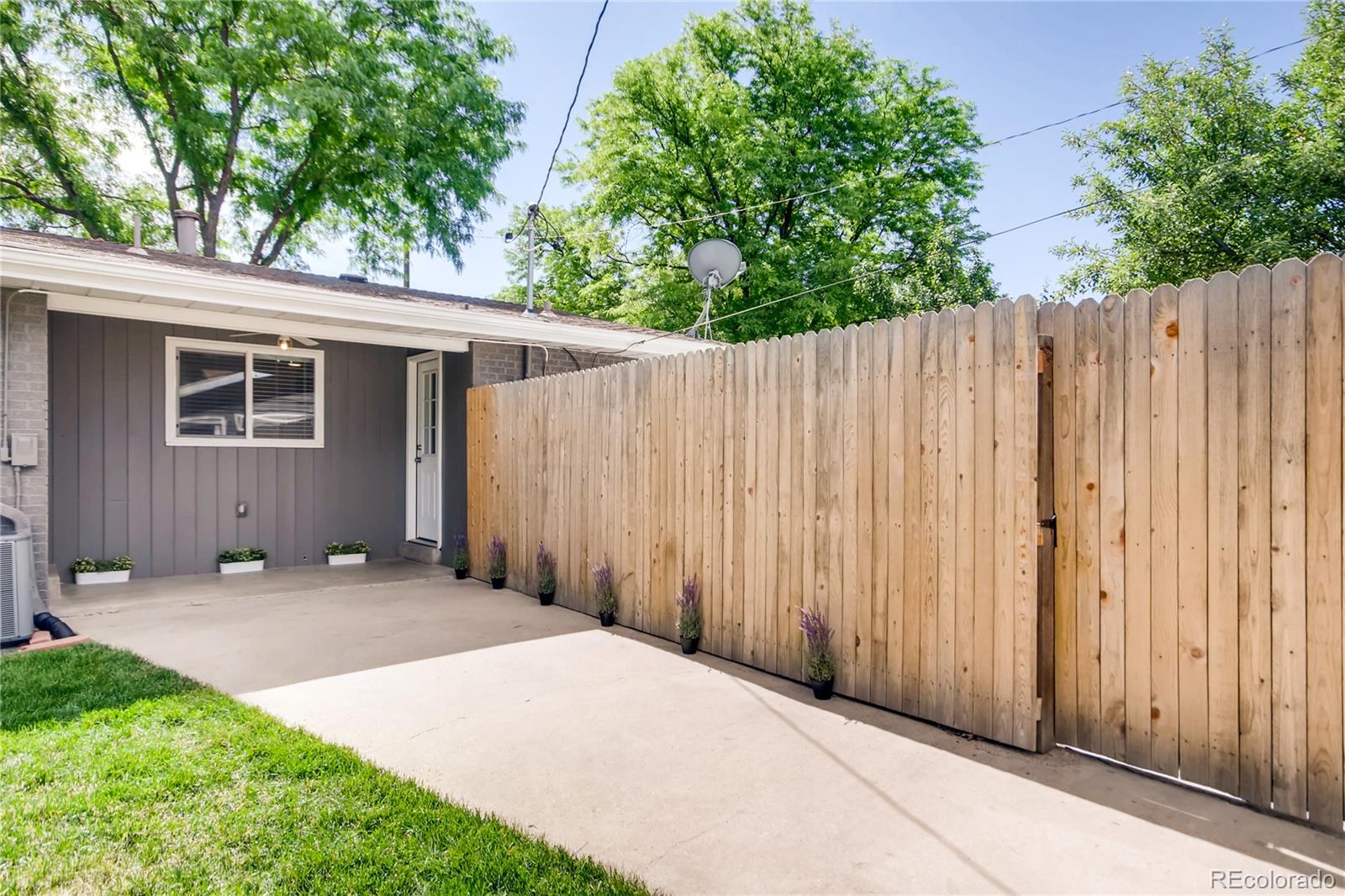 5655 Estes Street Arvada, CO 80002 - Photo 34 of 40 a view of a backyard with wooden fence
