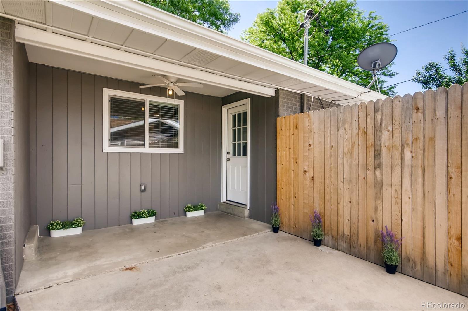 5655 Estes Street Arvada, CO 80002 - Photo 36 of 40 a backyard view with a wooden fencing