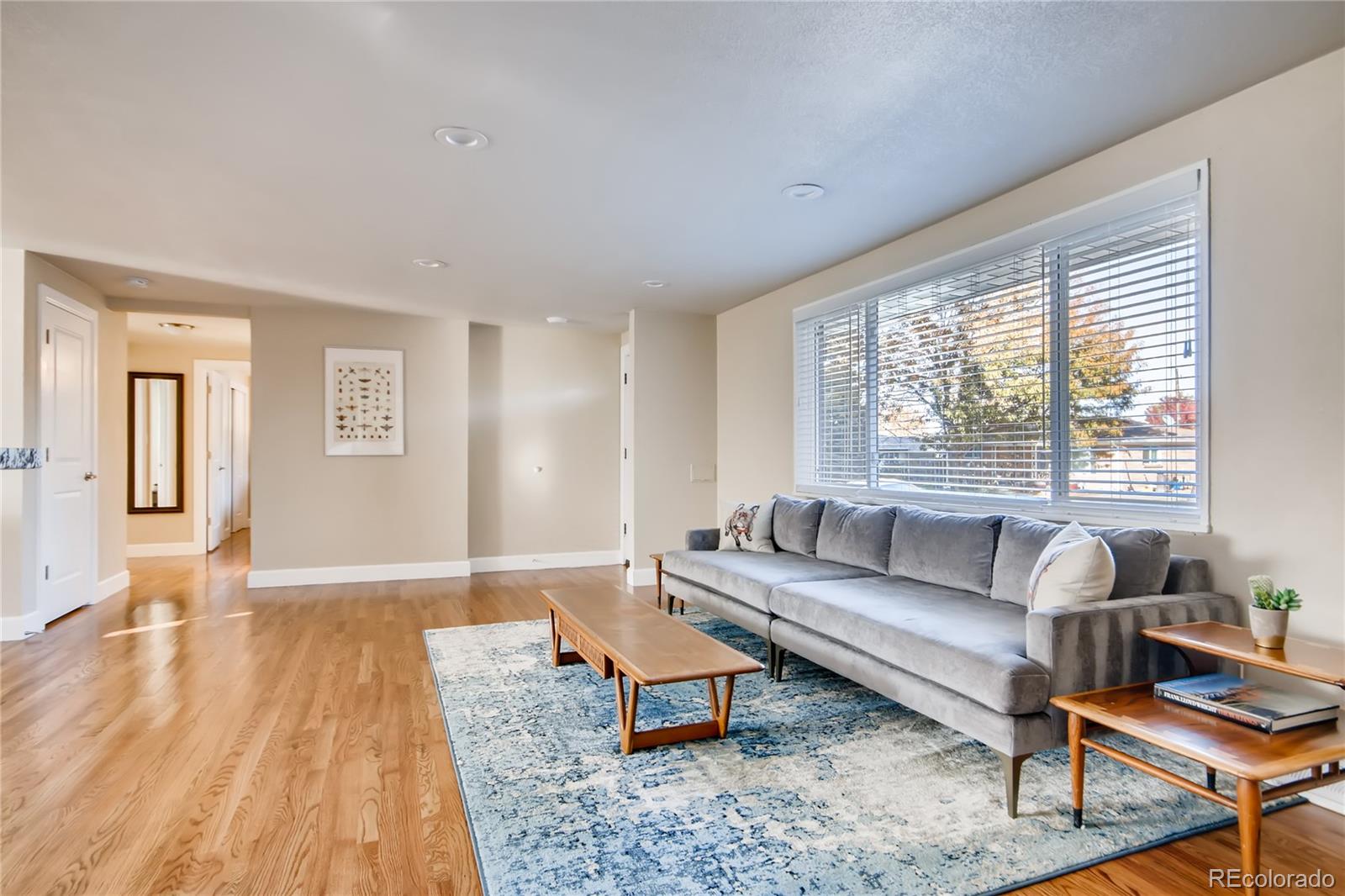 5655 Estes Street Arvada, CO 80002 - Photo 7 of 40 a living room with furniture and a large window