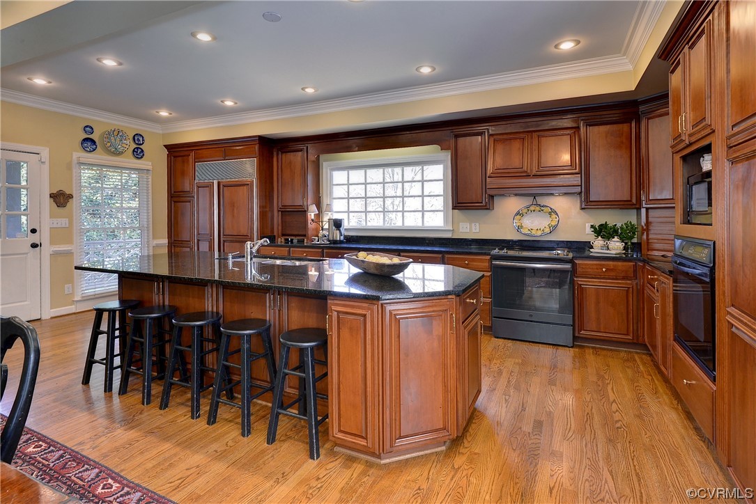 101 Spring Branch Williamsburg, VA 23185 - Photo 12 of 44 a kitchen with stainless steel appliances granite countertop counter space a sink and a refrigerator