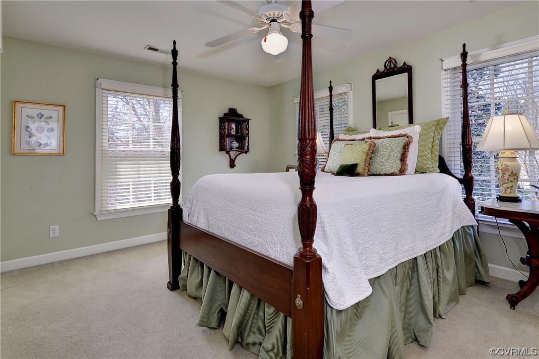 101 Spring Branch Williamsburg, VA 23185 - Photo 25 of 44 a bedroom with a bed a chandelier and a window