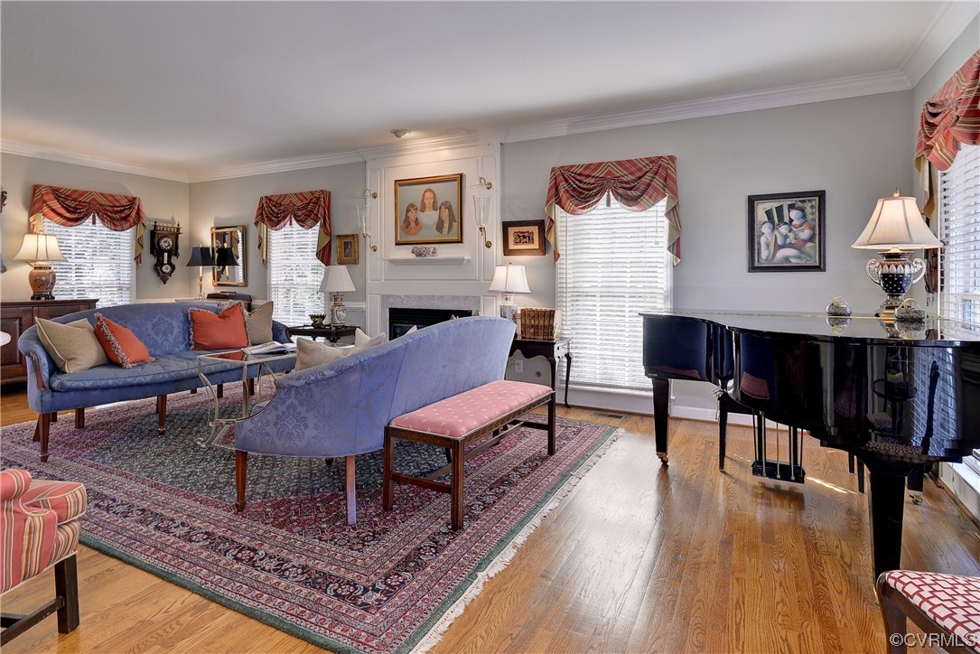 101 Spring Branch Williamsburg, VA 23185 - Photo 3 of 44 a living room with furniture a rug and a table