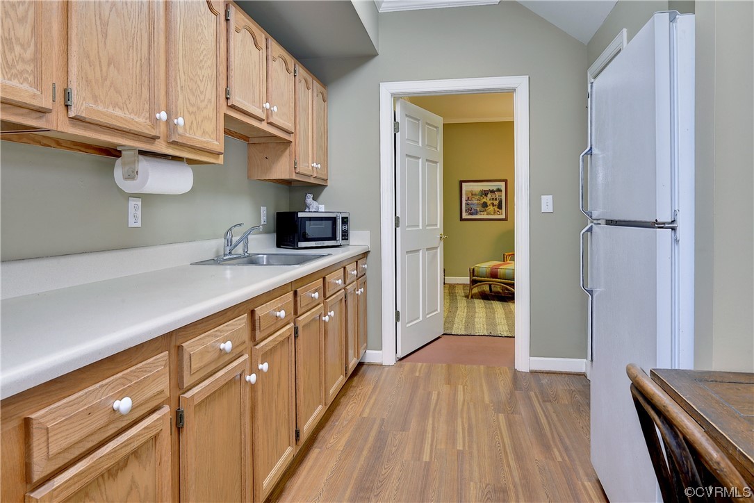 101 Spring Branch Williamsburg, VA 23185 - Photo 32 of 44 a kitchen with a sink window and cabinets