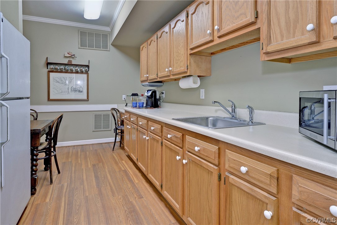 101 Spring Branch Williamsburg, VA 23185 - Photo 33 of 44 a kitchen with granite countertop a sink a stove and cabinets