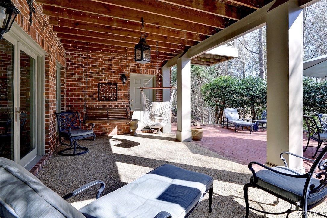 101 Spring Branch Williamsburg, VA 23185 - Photo 37 of 44 a outdoor space with patio the couches and a dining table with the view of the ocean