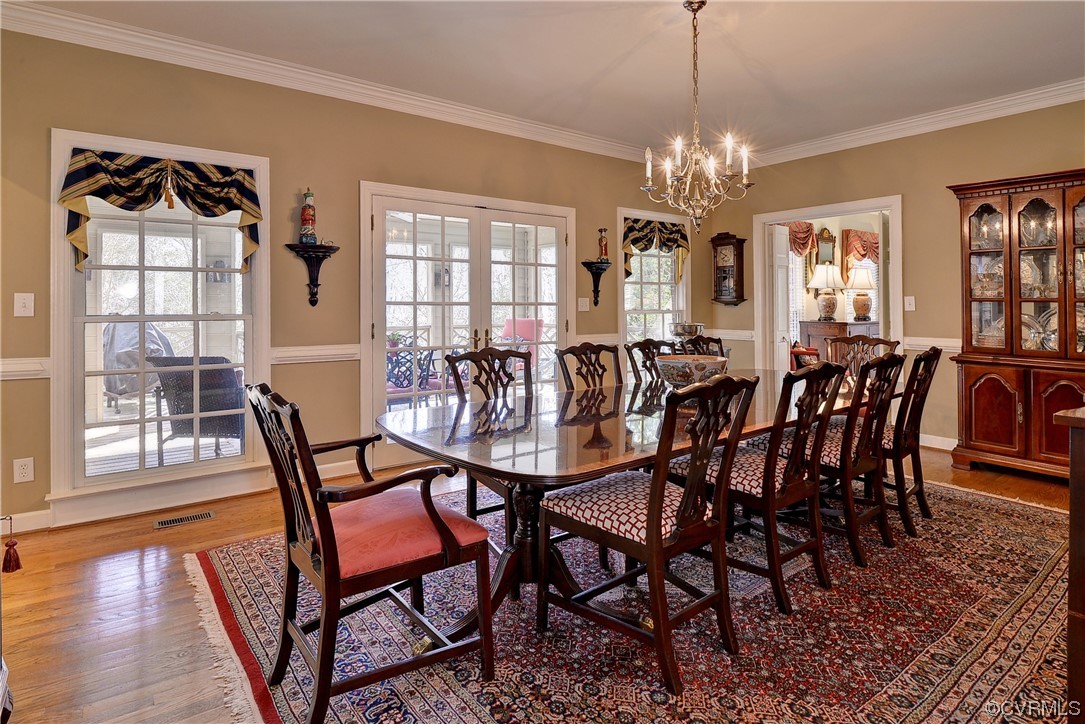 101 Spring Branch Williamsburg, VA 23185 - Photo 7 of 44 a view of a dining room with furniture window and wooden floor