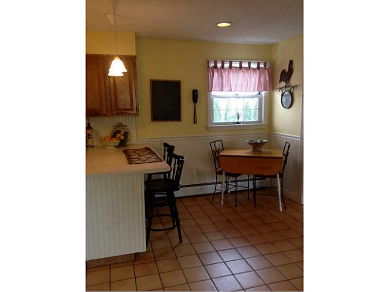 647 Bound Road Cumberland, RI 02895 - Photo 5 of 24 Kitchen. Main floor boasts large eat in kitchen with full dining room that flows perfectly off from it.