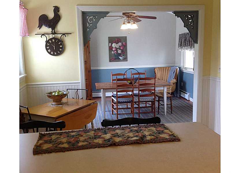 647 Bound Road Cumberland, RI 02895 - Photo 6 of 24 Dining Room. Warm and bright Dining room with vaulted ceilings with slider to gorgeous new stone patio located in the newly landscaped back yard.