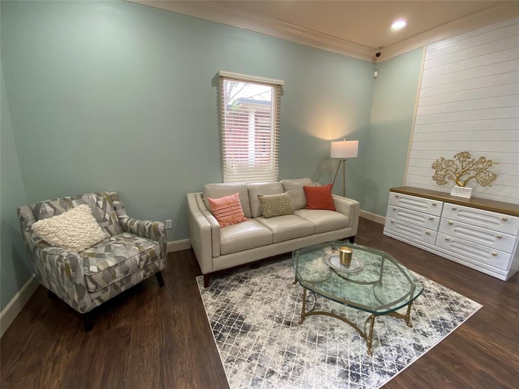 4501 Cartwright Road, Unit 408 Missouri City, TX 77459 - Photo 4 of 10 a living room with furniture and wooden floor