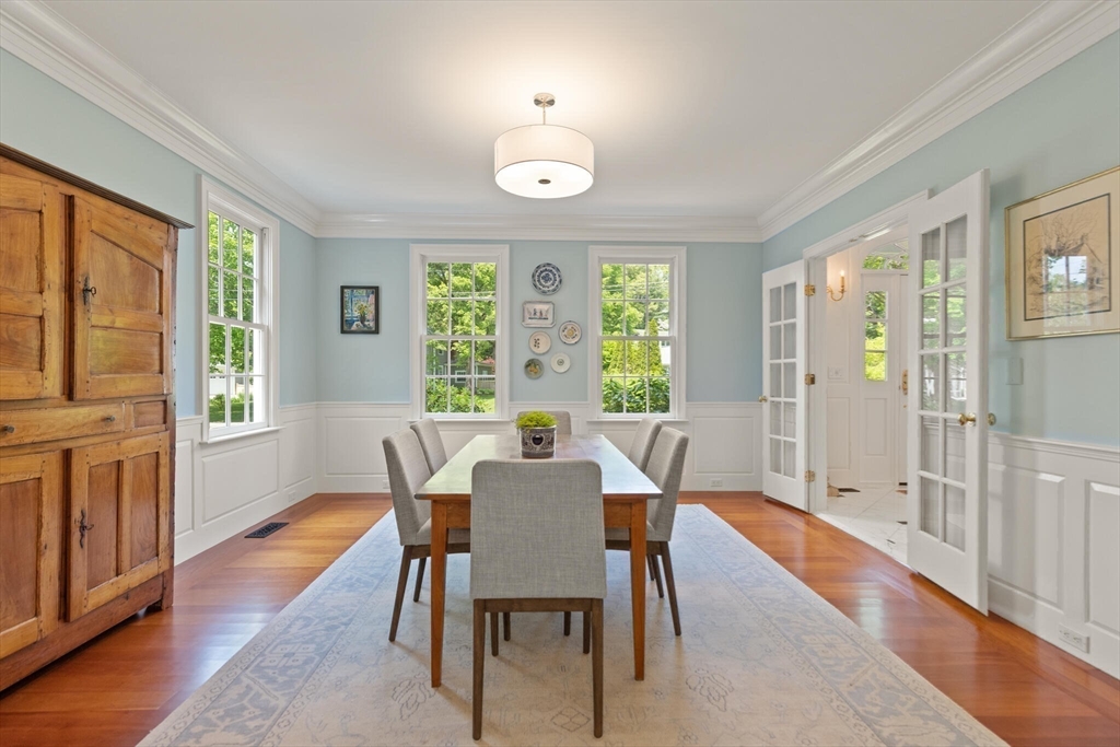 103 Revolutionary Road Concord, MA 01742 - Photo 12 of 36 a view of a dining room with furniture window and wooden floor