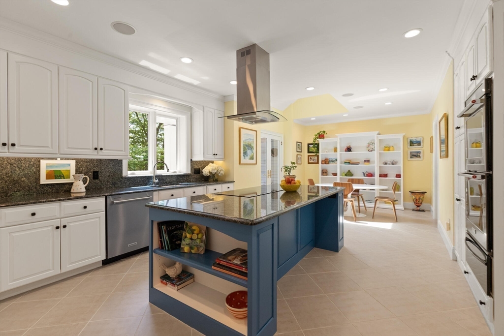 103 Revolutionary Road Concord, MA 01742 - Photo 14 of 36 a kitchen with stainless steel appliances granite countertop a stove oven and a refrigerator