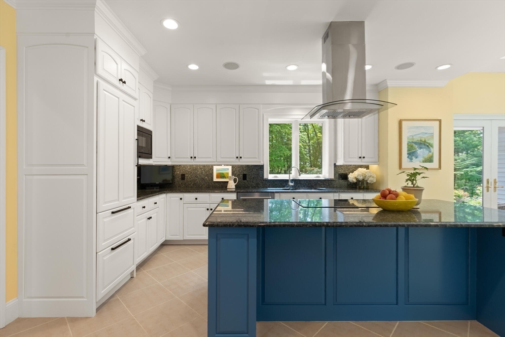 103 Revolutionary Road Concord, MA 01742 - Photo 15 of 36 a kitchen with stainless steel appliances granite countertop a sink a stove and a refrigerator