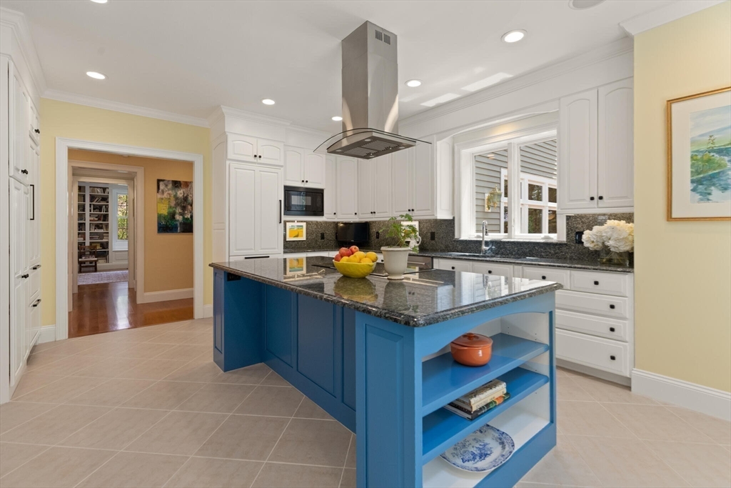 103 Revolutionary Road Concord, MA 01742 - Photo 16 of 36 a kitchen with granite countertop a sink and cabinets
