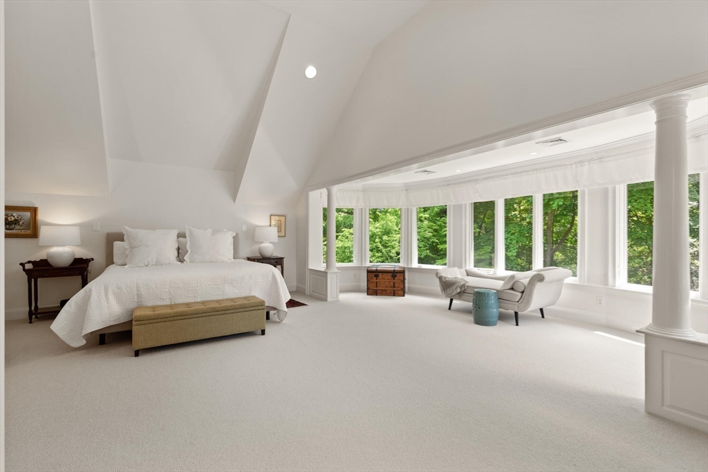 103 Revolutionary Road Concord, MA 01742 - Photo 21 of 36 a spacious bedroom with a large bed and a large window