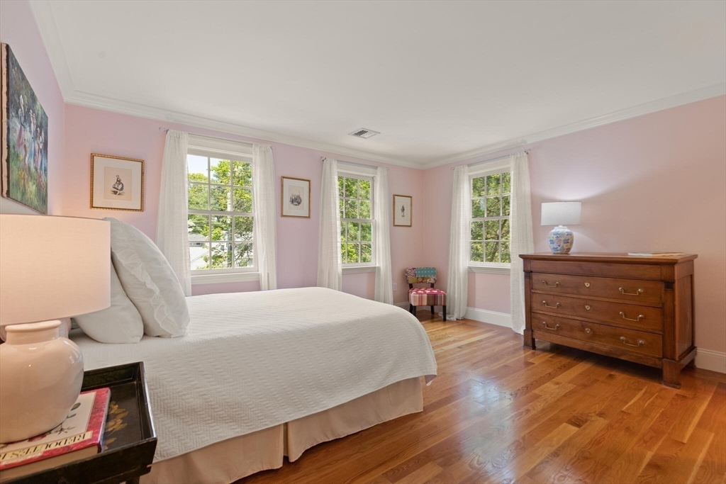 103 Revolutionary Road Concord, MA 01742 - Photo 23 of 36 a bedroom with a bed and large windows