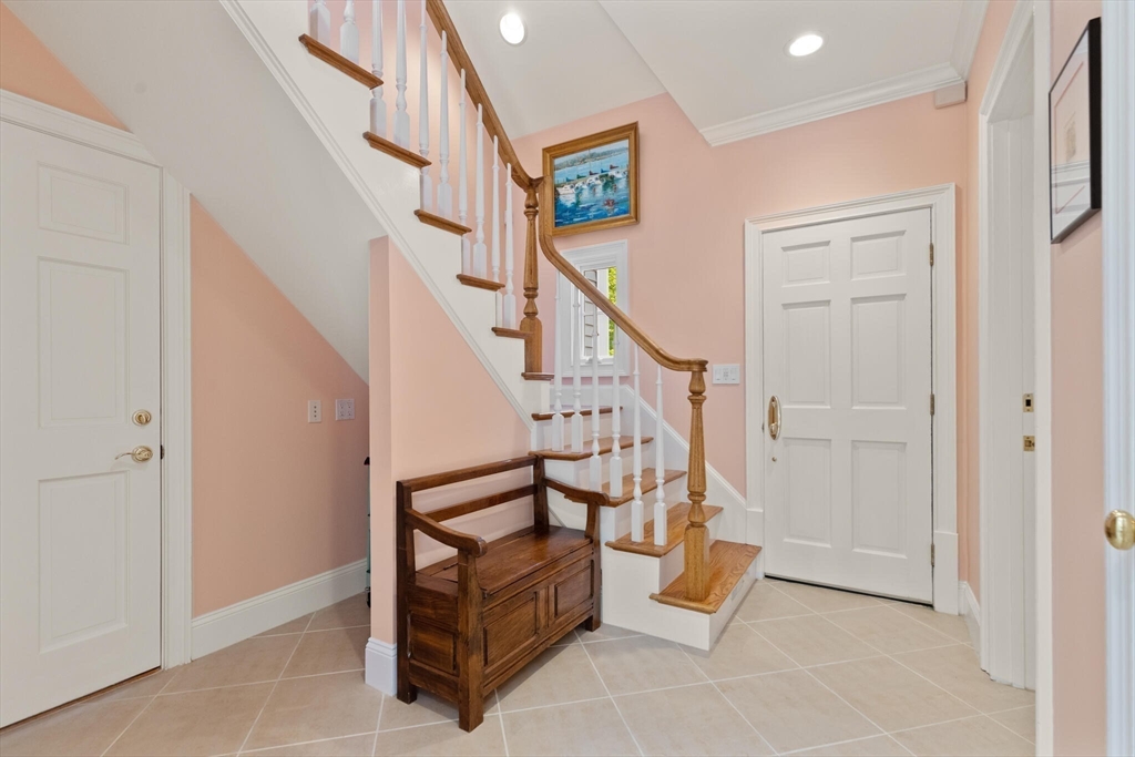 103 Revolutionary Road Concord, MA 01742 - Photo 29 of 36 a view of entryway with hardwood and stairs