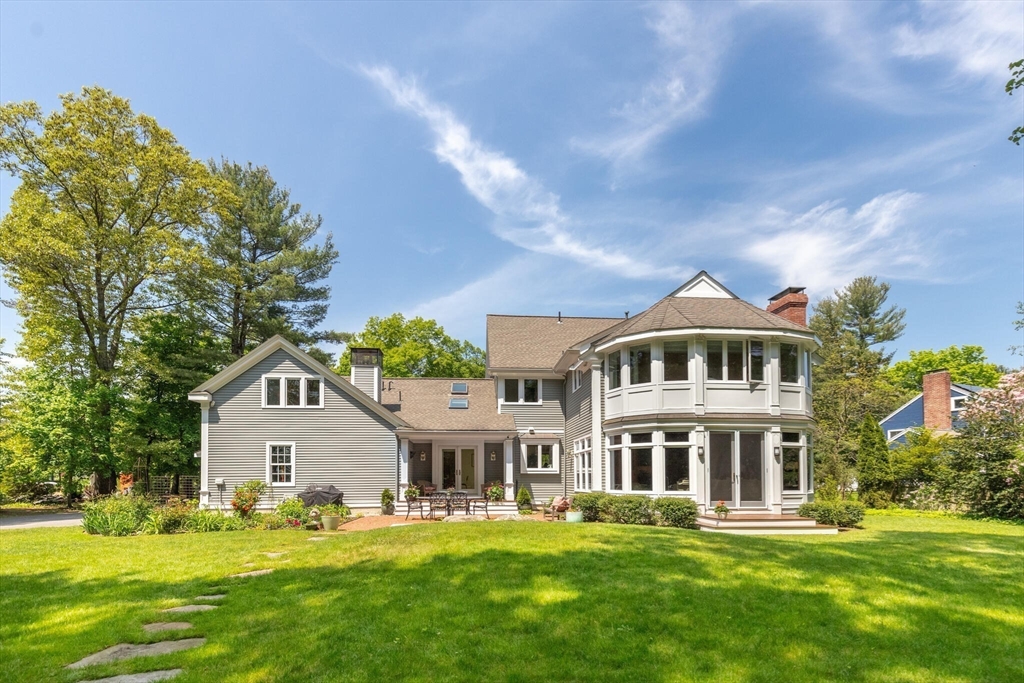 103 Revolutionary Road Concord, MA 01742 - Photo 30 of 36 a front view of a house with a yard