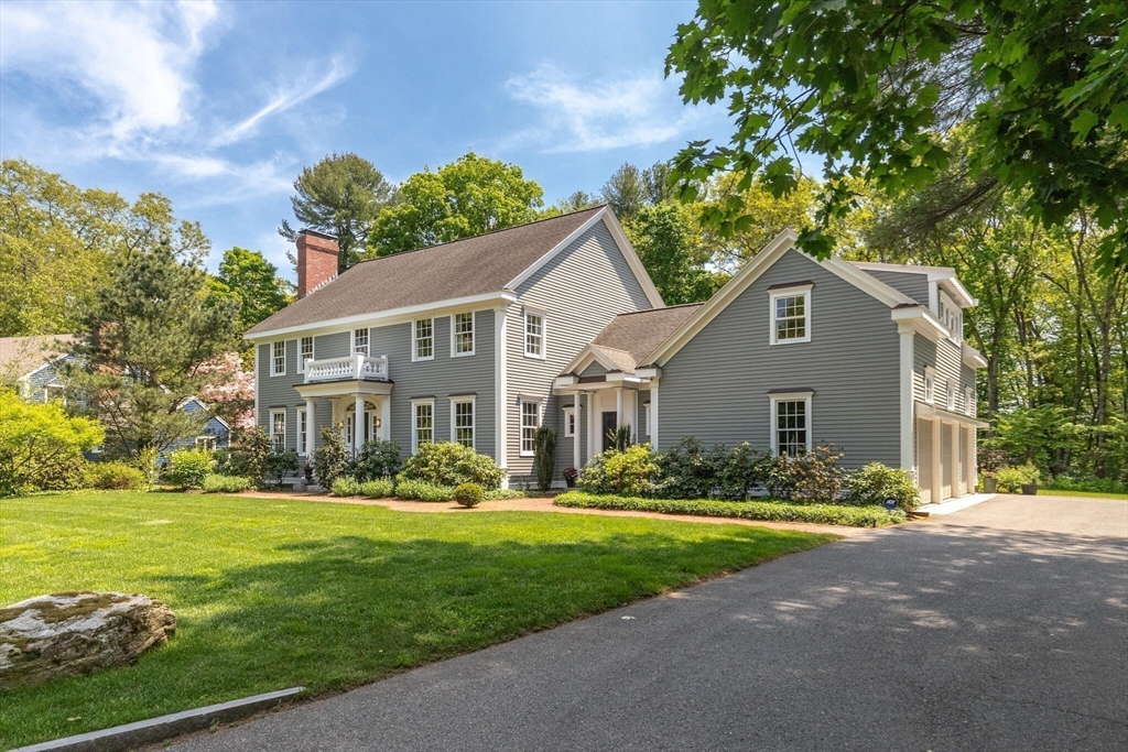 103 Revolutionary Road Concord, MA 01742 - Photo 3 of 36 a front view of house with yard and green space