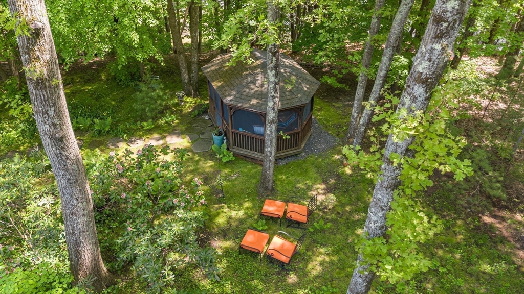 103 Revolutionary Road Concord, MA 01742 - Photo 34 of 36 a backyard of a house with table and chairs