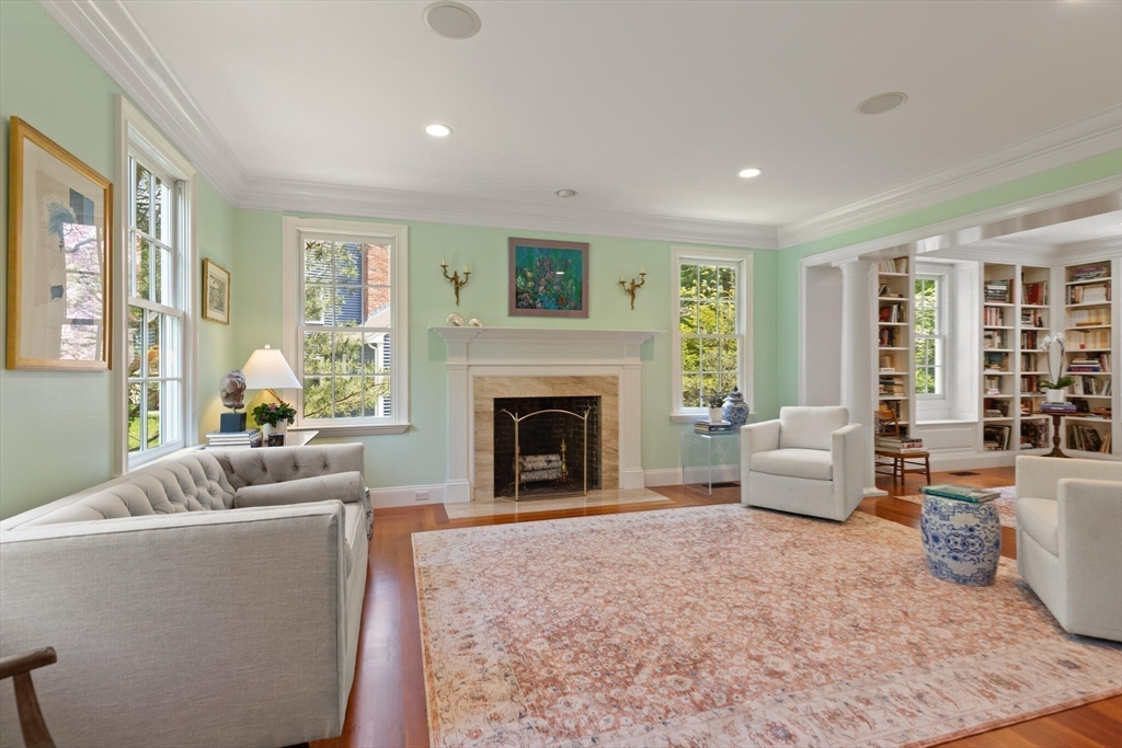 103 Revolutionary Road Concord, MA 01742 - Photo 8 of 36 a living room with furniture and a fireplace