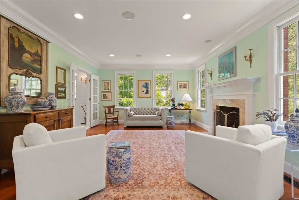 103 Revolutionary Road Concord, MA 01742 - Photo 9 of 36 a living room with furniture fireplace and a large window