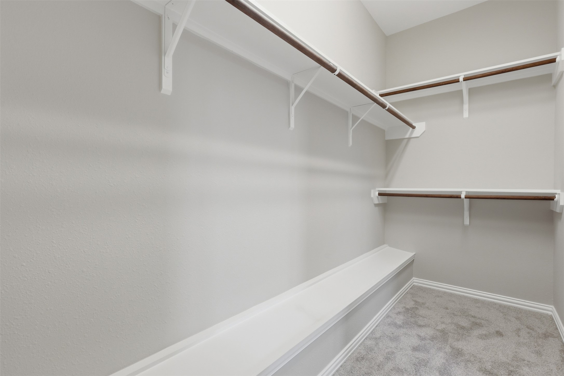 25926 Morgan Springs Spring, TX 77373 - Photo 22 of 49 The spacious walk-in closet offers abundant hanging space and built-in shelving, providing exceptional storage and organization for your wardrobe and everyday essentials.