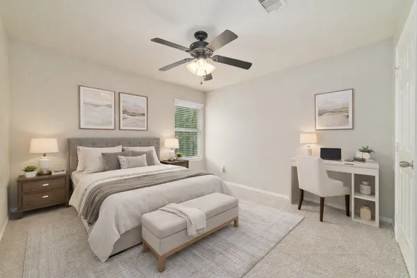 a spacious bedroom with a bed and a chandelier