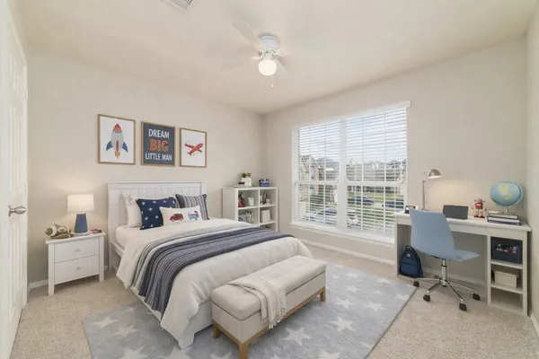 a bedroom with a large bed and a large window