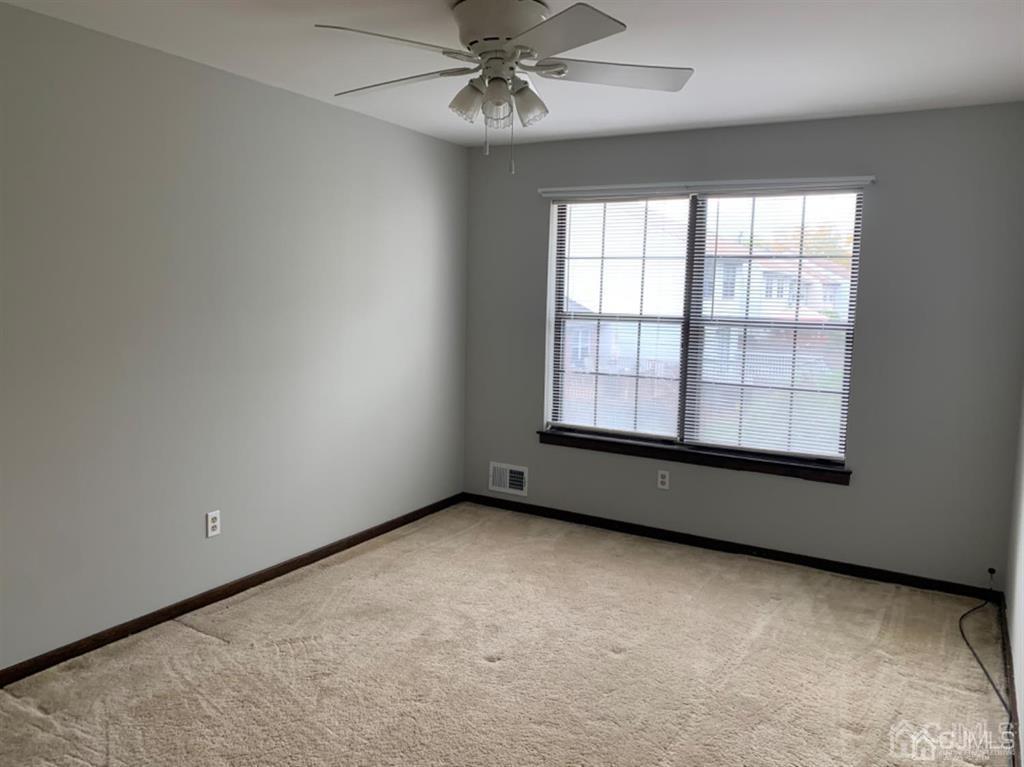 24 Pendleton Place Old Bridge, NJ 08857 - Photo 13 of 22 an empty room with a window