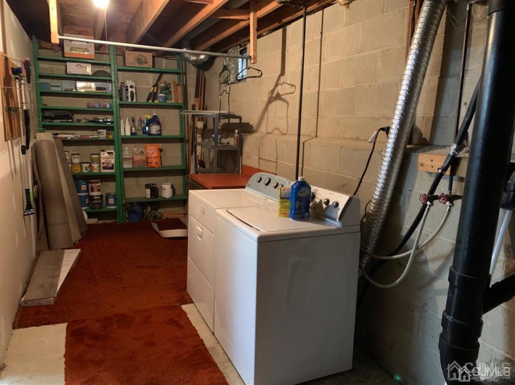 24 Pendleton Place Old Bridge, NJ 08857 - Photo 19 of 22 a storage room with washer and dryer