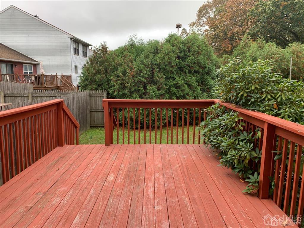 24 Pendleton Place Old Bridge, NJ 08857 - Photo 21 of 22 a balcony with wooden floor in front of house