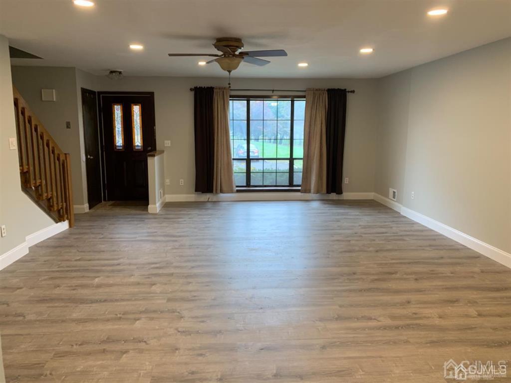 24 Pendleton Place Old Bridge, NJ 08857 - Photo 3 of 22 a view of an empty room with wooden floor and a window