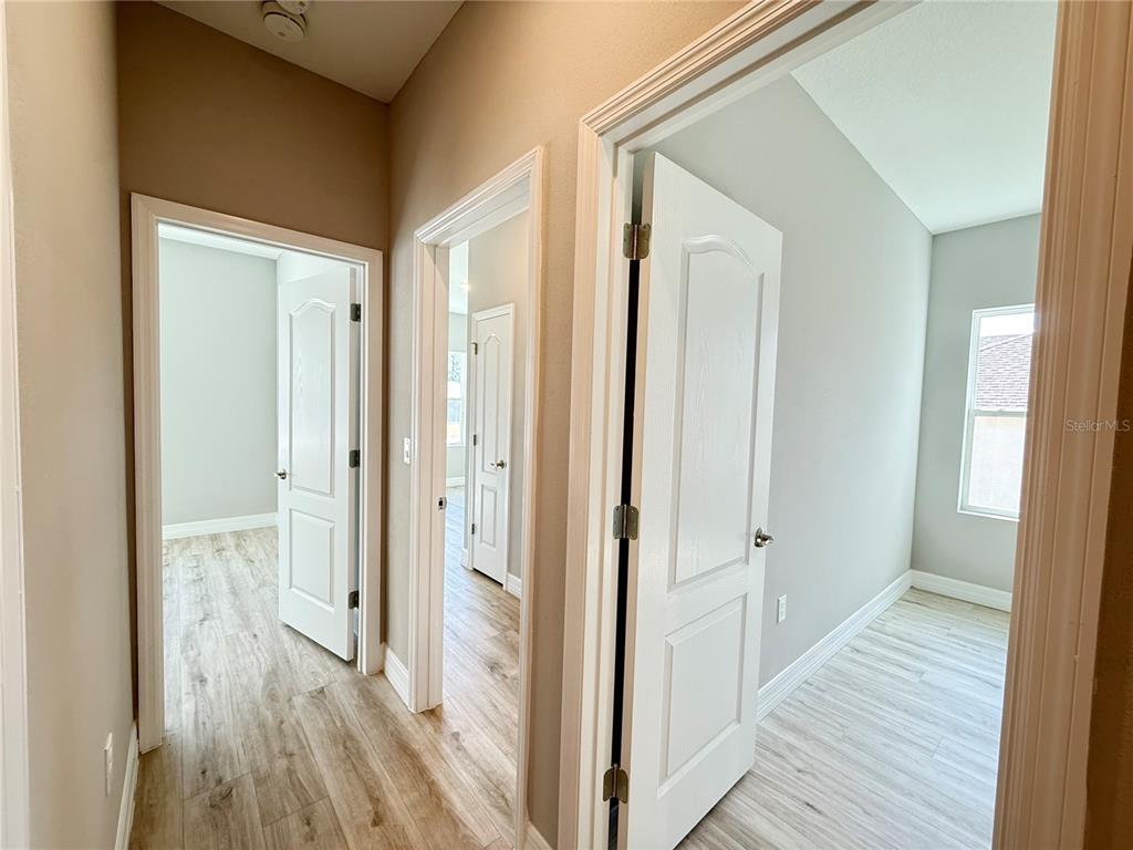 7815 Southwest 128th St Road Ocala, FL 34473 - Photo 13 of 40 a view of a bathroom from the hallway